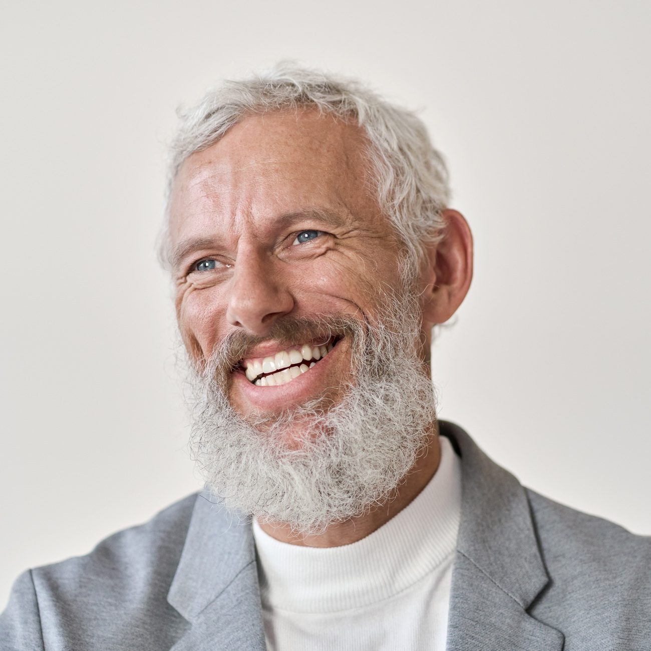 Happy old senior laughing business man isolated on white, headshot portrait.